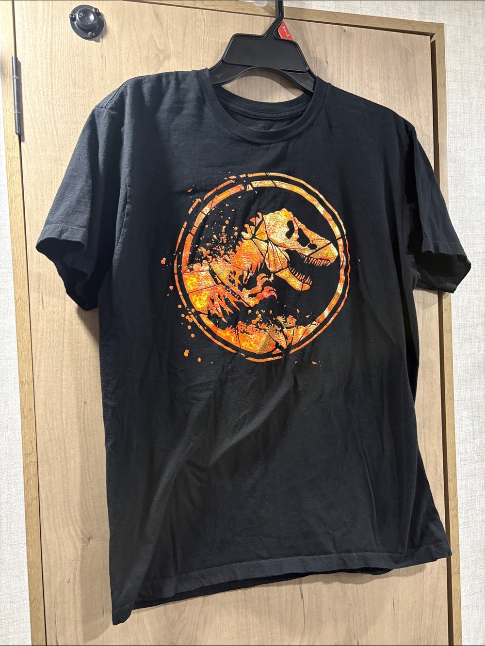 Universal Studios Black T-Shirt with Orange Dinosaur Skull Emblem